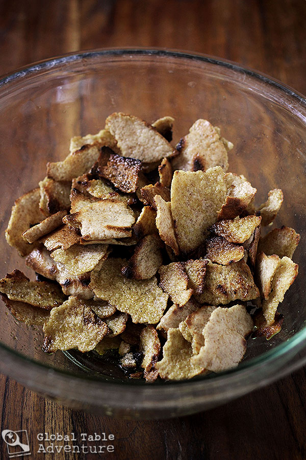 Toasting pita chips for Fattoush