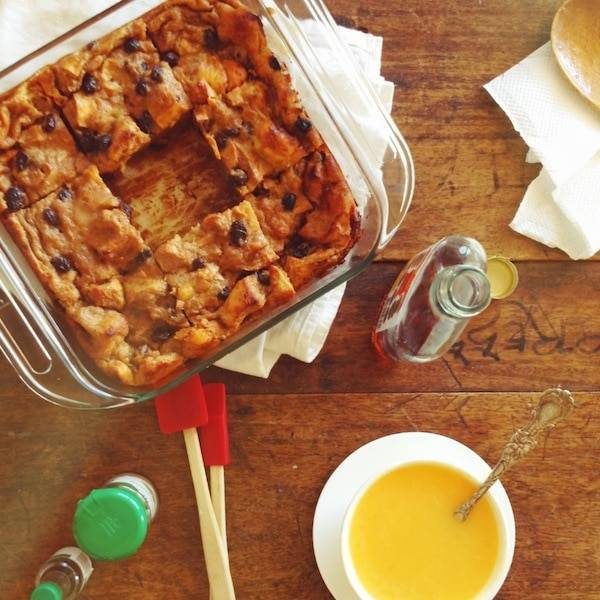 Pan of bars with baking ingredients on a table.
