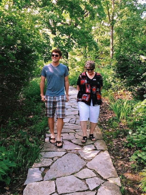 Man and woman walking on a sidewalk.