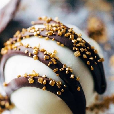 Minty Chocolate Cake Bites on pan with chocolate drizzle.