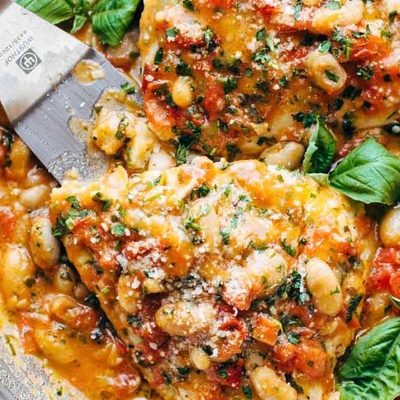Garlic Basil Barramundi in a skillet with spatula.