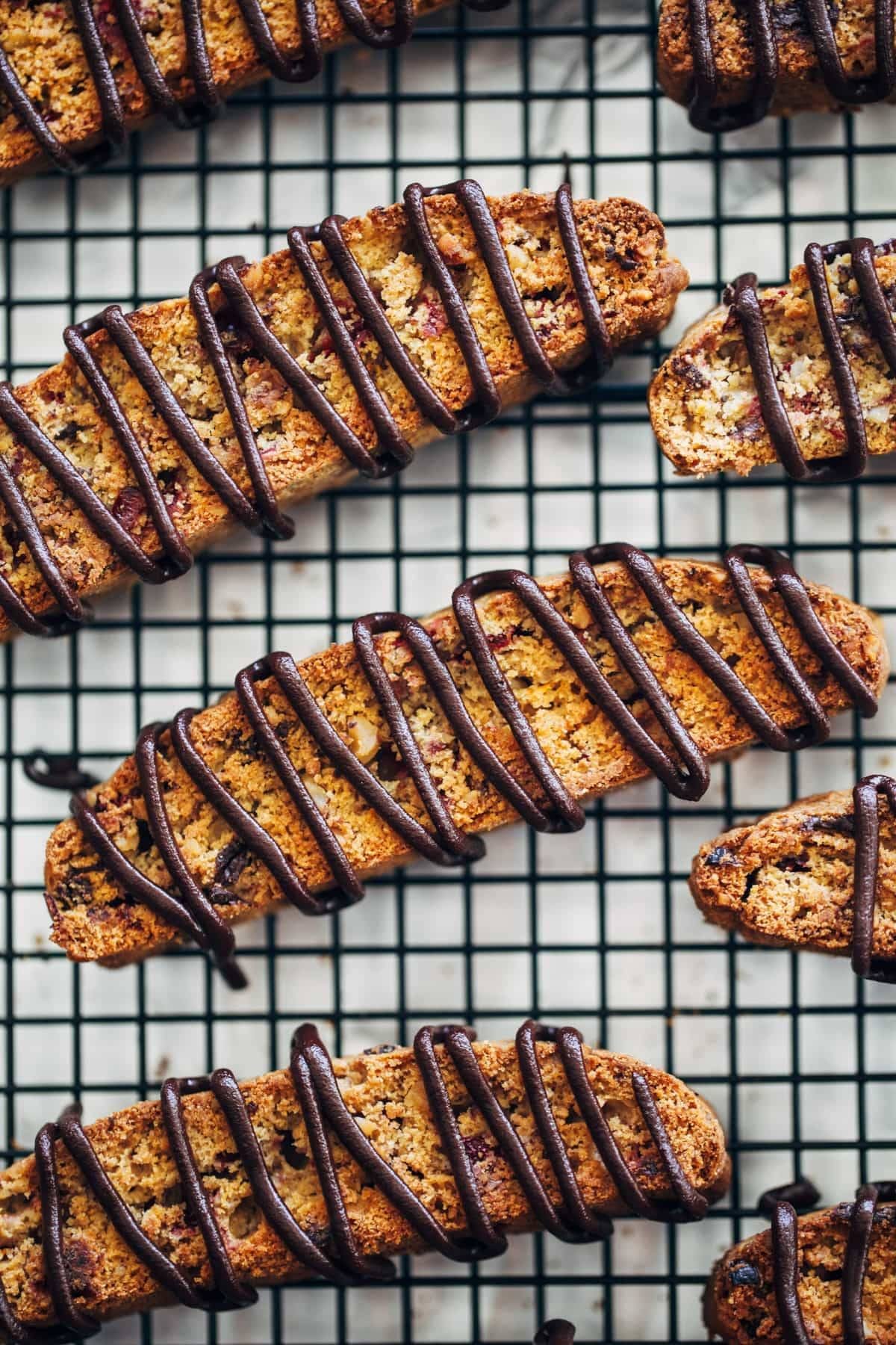 Cranberry Dark Chocolate Biscotti on a drying rack.